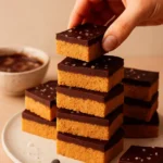 No-bake chocolate peanut butter dessert with chocolate drizzle on top