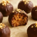 Peanut Butter Pretzel Truffles drizzled with chocolate on a white plate