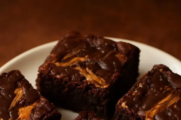 Delicious Peanut Butter Swirl Brownies topped with creamy peanut butter swirls