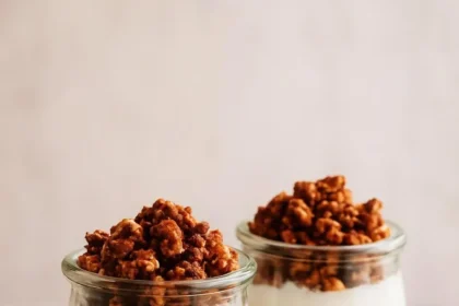 Bowl of pumpkin pie overnight oats topped with spices and pumpkin seeds