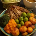 Delicious slow cooked lamb shoulder served with Yorkshire pudding and mashed potatoes.