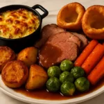 Delicious Sunday Roast served with vegetables and gravy