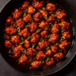 Super Garlicky Indo-Chinese Garlic Pepper Chicken served in a bowl