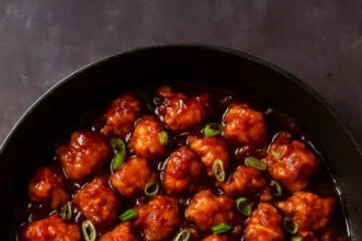 Super Garlicky Indo-Chinese Garlic Pepper Chicken served in a bowl