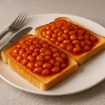 Delicious tinned tomatoes on toast served on a plate