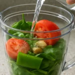 Vegan Spinach Tofu Cheese served with fresh herbs and greens