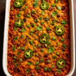 Delicious Vegan Tex-Mex Rice Casserole in a baking dish, garnished with cilantro.