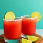 Refreshing watermelon margaritas in a glass with lime garnish
