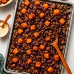 Delicious winter sheet pan meal with vegetables and chicken baked together.