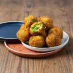Crispy broccoli cheese bites served on a plate, perfect for snacking