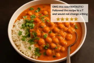 Delicious serving of Indian Butter Chickpeas in a bowl with naan and cilantro.