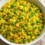A bowl of Instant Pot Indian Cabbage and Peas, showcasing vibrant colors and healthy ingredients.