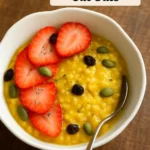 Bowl of Turmeric Steel Cut Oats topped with fruits and nuts