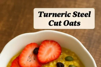 Bowl of Turmeric Steel Cut Oats topped with fruits and nuts