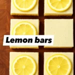 A plate of homemade vegan lemon bars garnished with lemon slices.