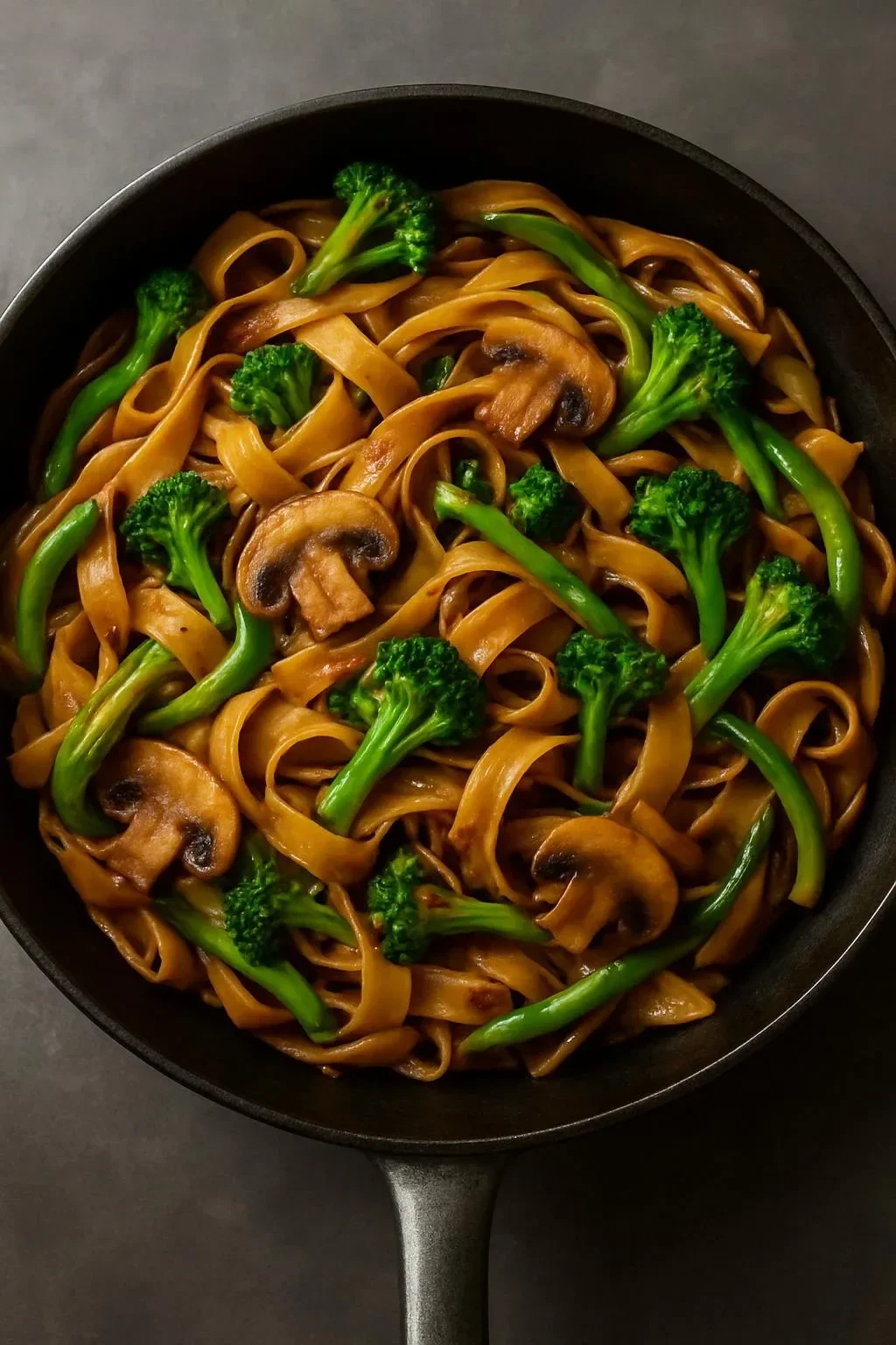 A vibrant plate of Vegan Thai Skillet Noodles with fresh vegetables and herbs.