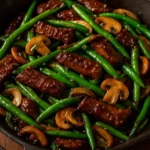 Black Pepper Beef, Mushroom, and Green Bean Stir-Fry served in a bowl