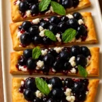 Berries and chèvre flatbread topped with fresh fruits and cheese