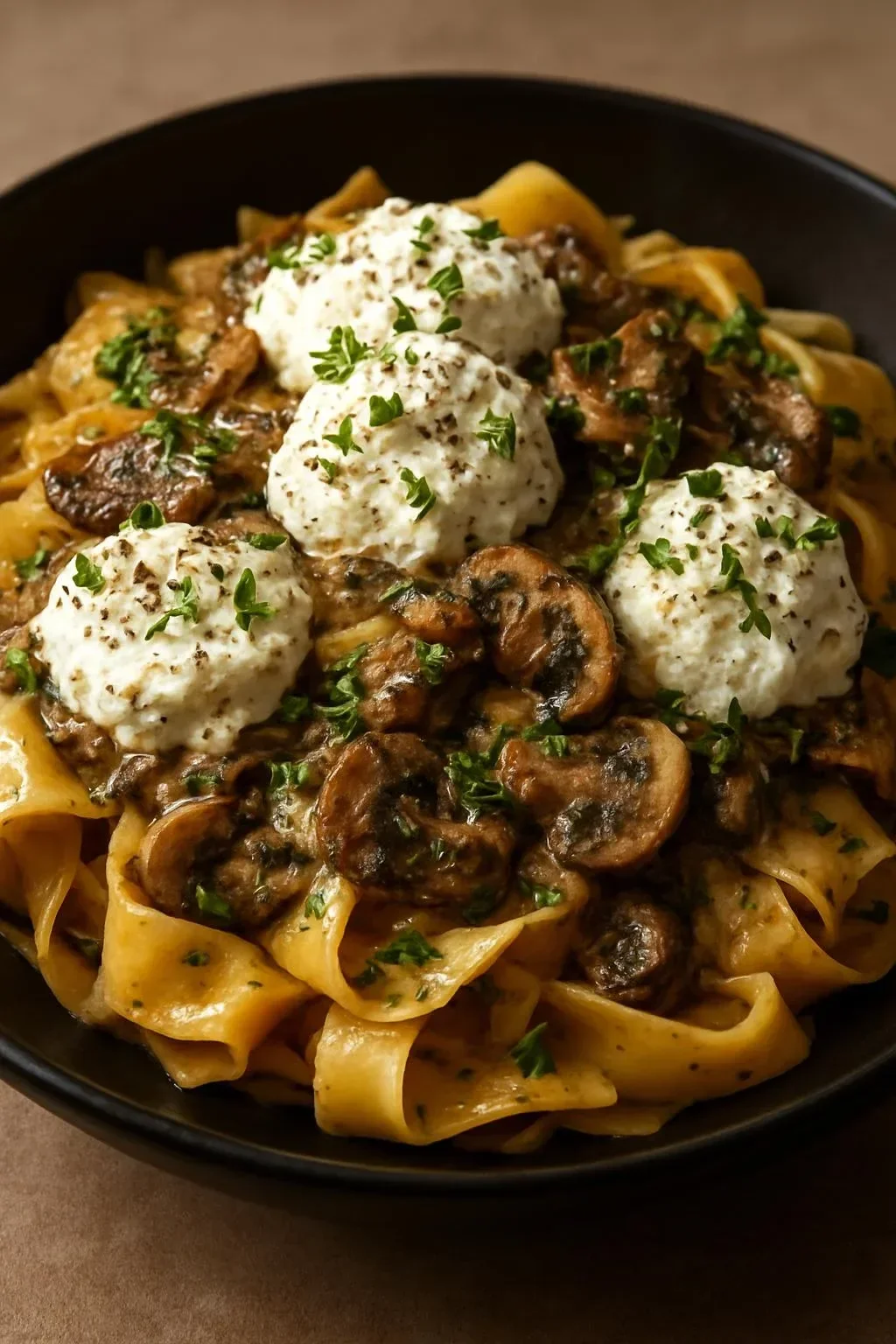 Creamy chicken and mushroom pappardelle pasta topped with burrata cheese