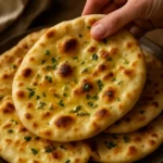 Freshly baked garlic naan with herbs and seasoning