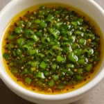 A vibrant ginger lime sauce served in a bowl, ideal for enhancing various dishes.