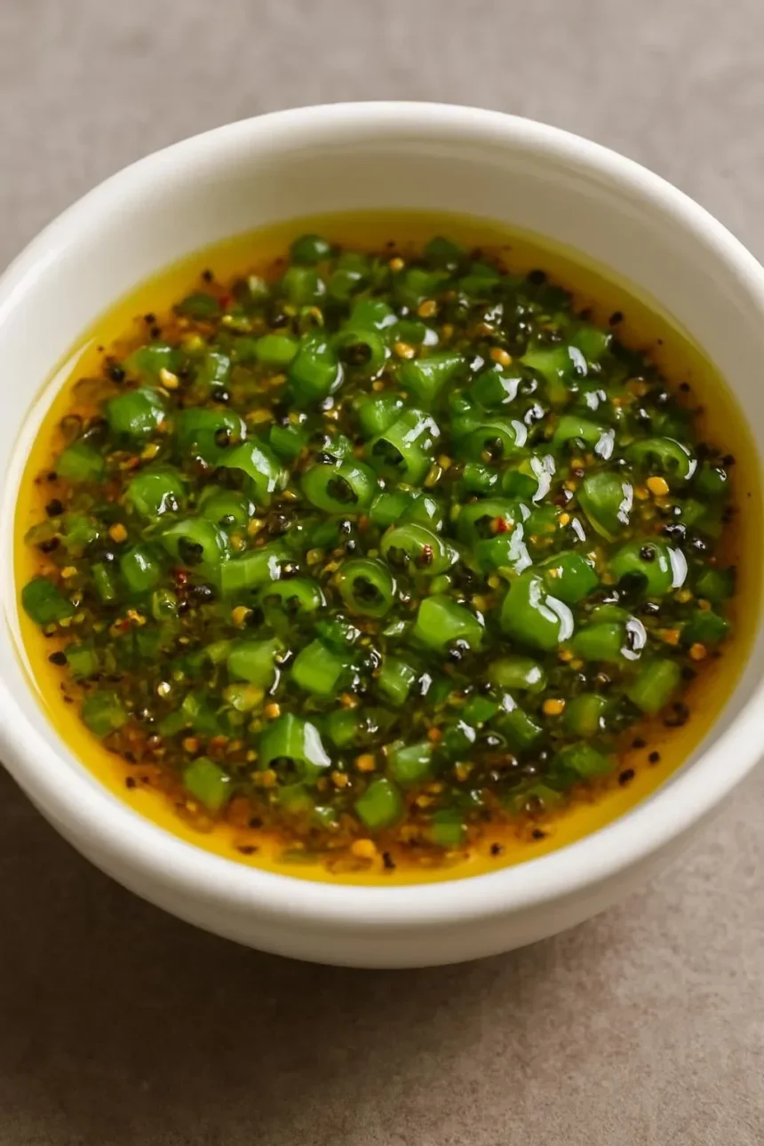A vibrant ginger lime sauce served in a bowl, ideal for enhancing various dishes.