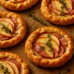 Mini Apple, Ham & Gruyère Galettes served on a plate