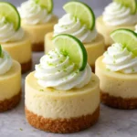 Delicious Mini Key Lime Cheesecakes displayed on a dessert table.