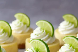 Delicious Mini Key Lime Cheesecakes displayed on a dessert table.