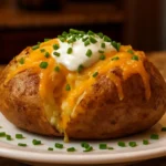 Delicious perfectly baked potato served with toppings.