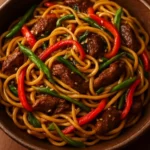 Delicious sweet and spicy garlic noodle stir-fry with vibrant vegetables.